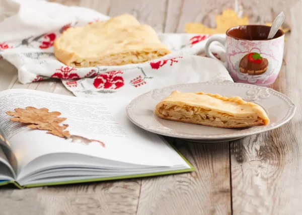 Cabbage pie on wooden background. — Stock Photo, Image