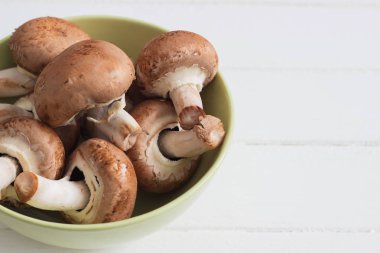 Brown champignons white background.