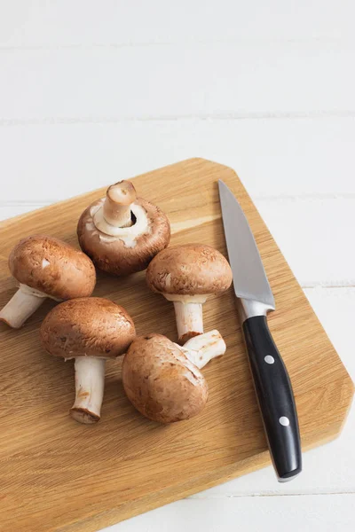 Brown champignons white background. — Stockfoto