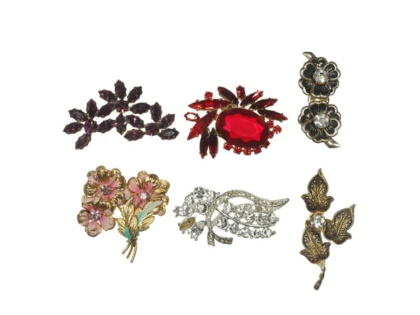 Old brooches with flowers of metal and colorful glass isolated o — Stock Photo, Image