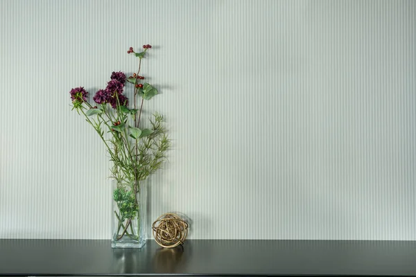 Beautiful plant in grass on black table — Stock Photo, Image