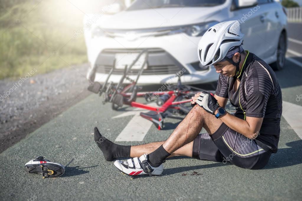Accident Concept,Unconscious male cyclist lying on road