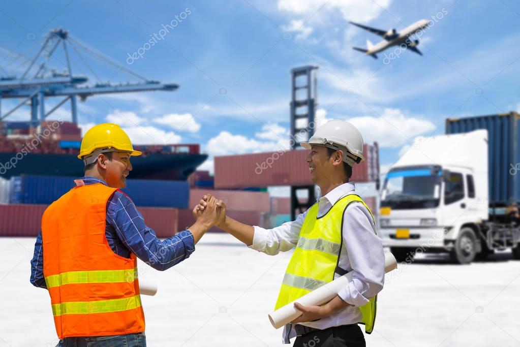 Two Foreman control loading Containers box