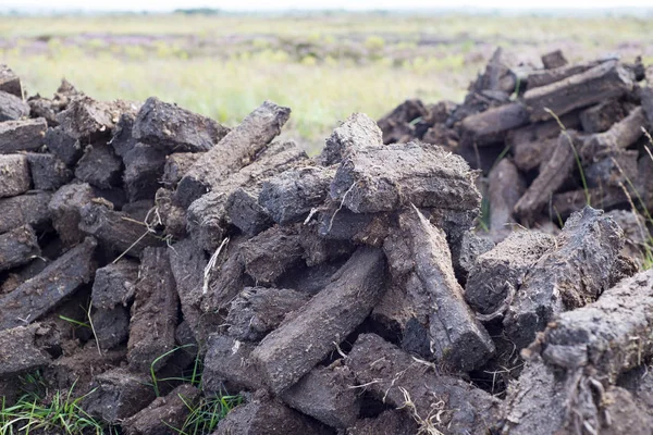 Sods of turf stacked up to dry Royalty Free Stock Images