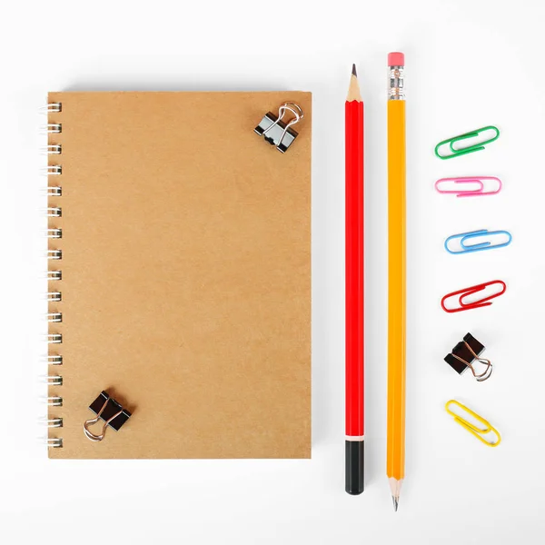 Stationery - Notebook, binder clip, paperclip and pencils — Stock Photo, Image