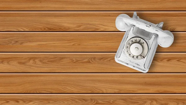Pelar el teléfono vintage blanco sobre un fondo de madera — Foto de Stock