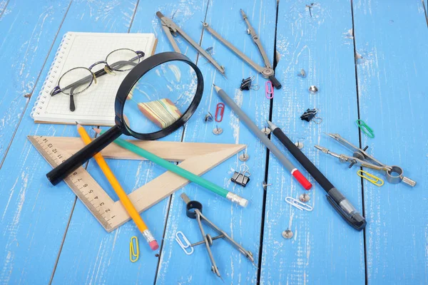 Science and education. Desktop scientist objects blue wooden bac — Stock Photo, Image