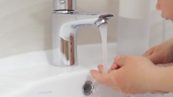 Girl Carefully Rinses Her Babys Hands — Stock Video