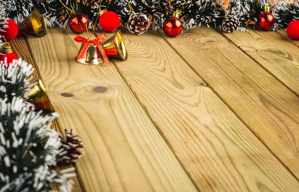 Christmas Decoration, Gifts tree branches and bells on wooden bo — Stock Photo, Image