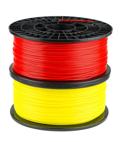 Spoelen van de rode en gele filament voor 3D-print — Stockfoto