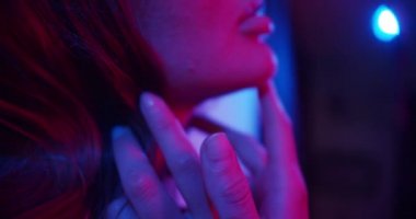Fashion model girl in neon light