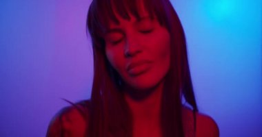 Fashion model girl in neon light sequence of multiple frames