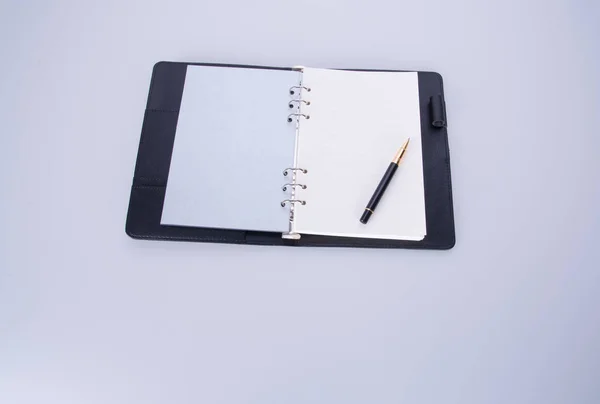 Diary or notebook with pen on the background. — Stock Photo, Image