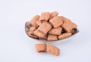 bir arka plan üzerinde krem çikolata çerez ya da bisküvi dolu.