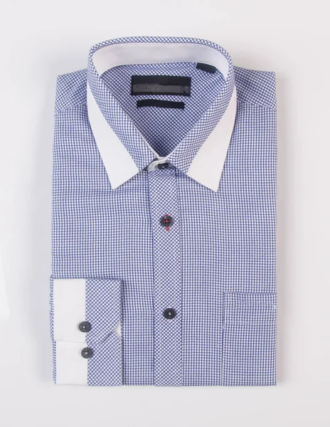 Camisa para homens dobrado em um fundo . — Fotografia de Stock