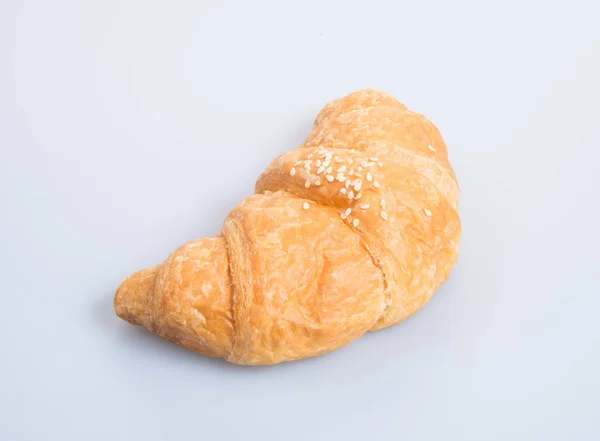 Croissant eller välsmakande croissant på bakgrunden. — Stockfoto