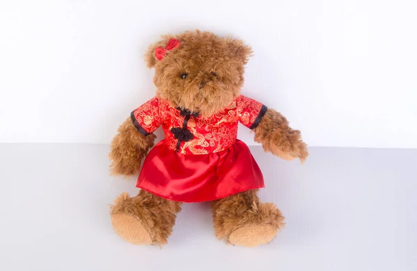 Toy or teddy bear with chinese red shirt on background. — Stock Photo, Image