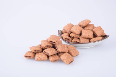 bir arka plan üzerinde krem çikolata çerez ya da bisküvi dolu.