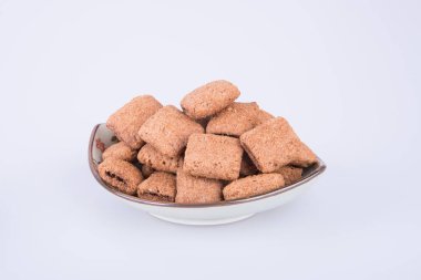 bir arka plan üzerinde krem çikolata çerez ya da bisküvi dolu.