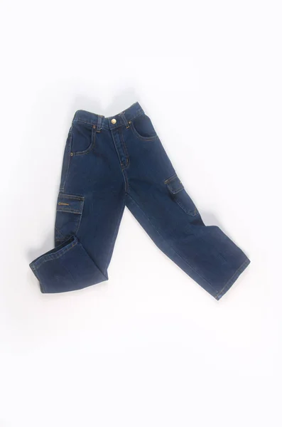 Jeans of jeans voor jong geitje op een achtergrond. — Stockfoto