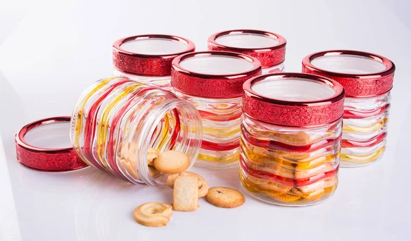 Glass or glass jar with cookies on a background. — Stock Photo, Image