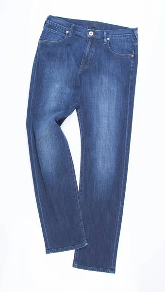 Kot pantolon veya bir arka plan üzerinde mavi jeans. — Stok fotoğraf