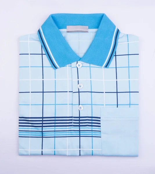 Camisa ou homens dobrado polo camisa no fundo . — Fotografia de Stock