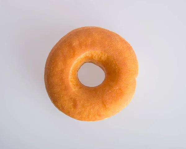 Donut lub smaczne pączki na tle. — Zdjęcie stockowe