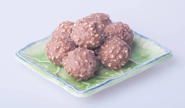 Chocolate ball or chocolate bonbon on a background. — Stock Photo, Image