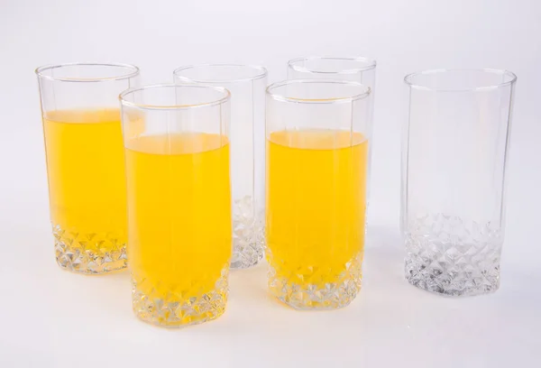 Orange juice in glasses on white background. — Stock Photo, Image