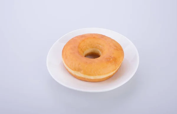 Donut ou saboroso donut no fundo . — Fotografia de Stock