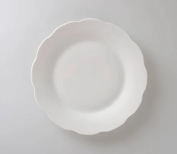 Тарелка или пустая тарелка на заднем плане . — стоковое фото