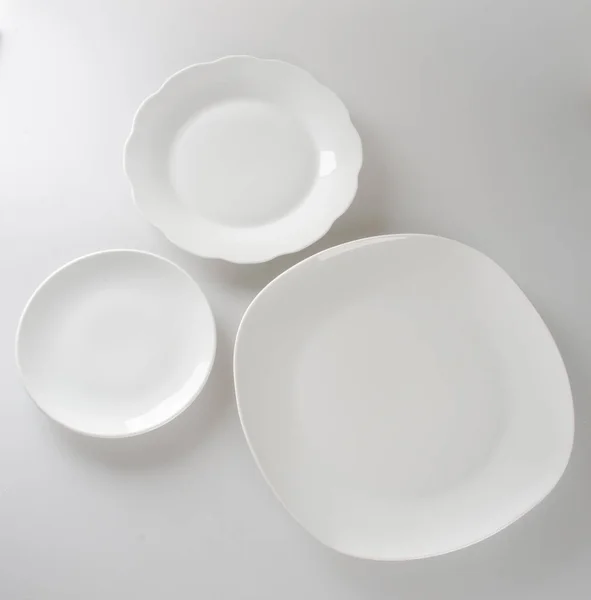 Plate or empty plate on a background. — Stock Photo, Image