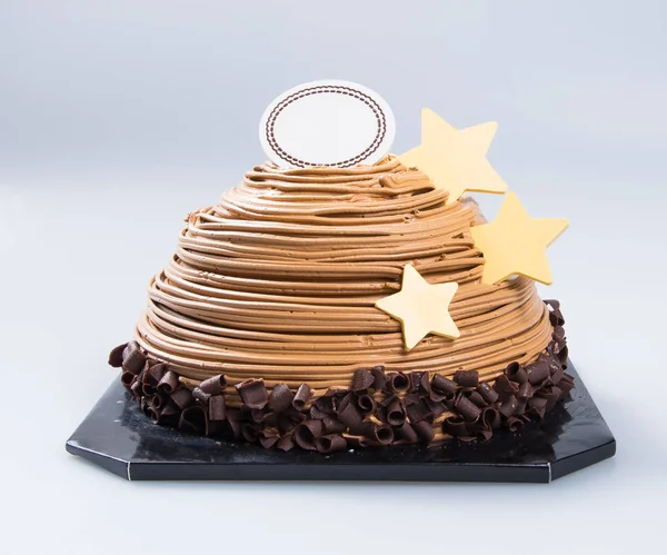 Gebak of chocolade cake op een achtergrond. — Stockfoto