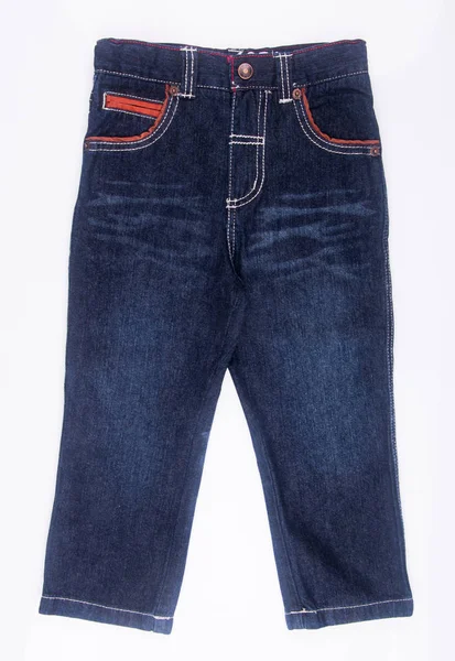 Jeans o jeans carini per bambini su uno sfondo . — Foto Stock