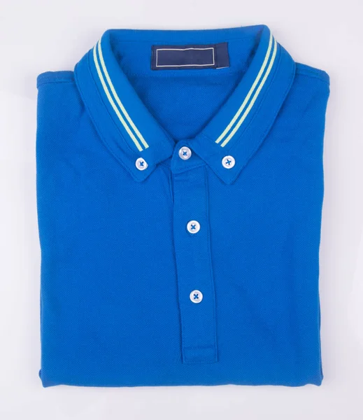 Shirt or mens folded polo shirt on background. — Stock Photo, Image