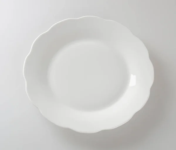 Plate or empty plate on a background. — Stock Photo, Image