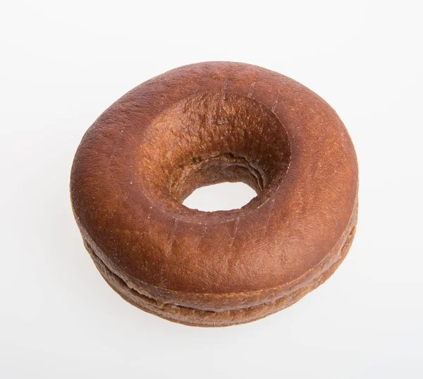 Donut ou donut fresco em um fundo . — Fotografia de Stock