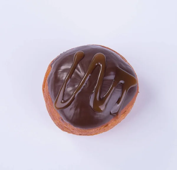 Dona o donut de chocolate sobre un fondo . —  Fotos de Stock