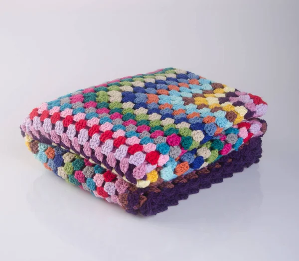 blanket or crochet blanket on a background.