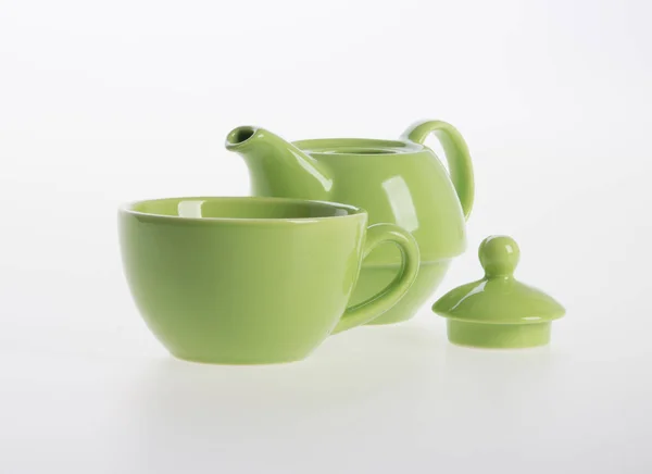 Çay potu seti veya porselen çaydanlık ve bardak arka plan üzerinde. — Stok fotoğraf