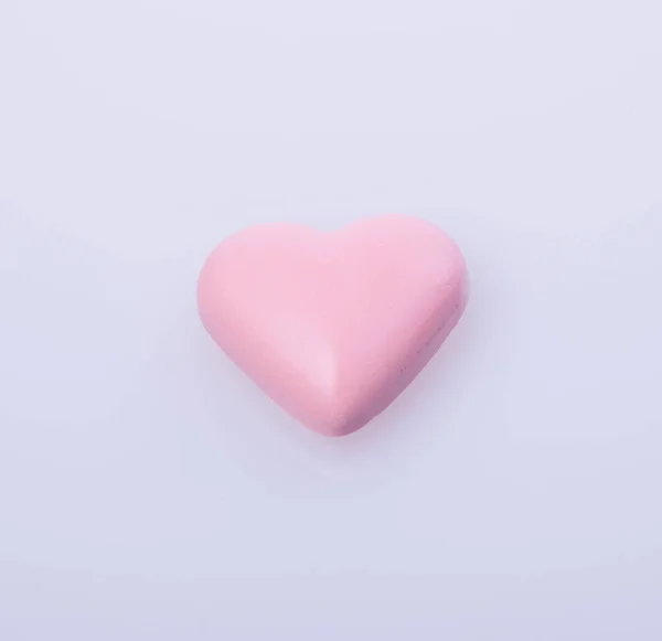 Chocolate em cor rosa ou chocolate em forma de amor . — Fotografia de Stock