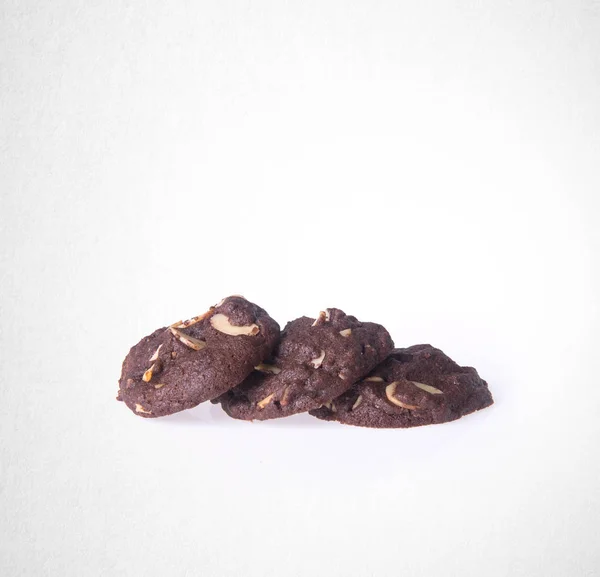 Pliki cookie lub pliki cookie migdałów czekolada na tle. — Zdjęcie stockowe