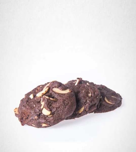 Pliki cookie lub pliki cookie migdałów czekolada na tle. — Zdjęcie stockowe