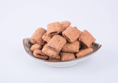 bir arka plan üzerinde krem çikolata çerez ya da bisküvi dolu.