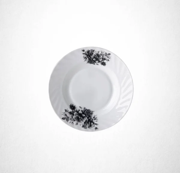 Пластины или цветы на тарелке окрашены вручную на заднем плане . — стоковое фото
