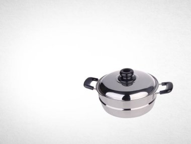 pot veya paslanmaz çelik bir arka plan üzerinde pot pişirme.