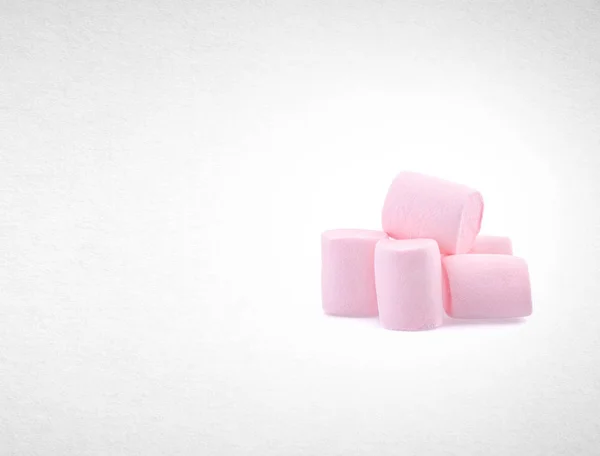 Marshmallows lub grupy porcję na tle. — Zdjęcie stockowe