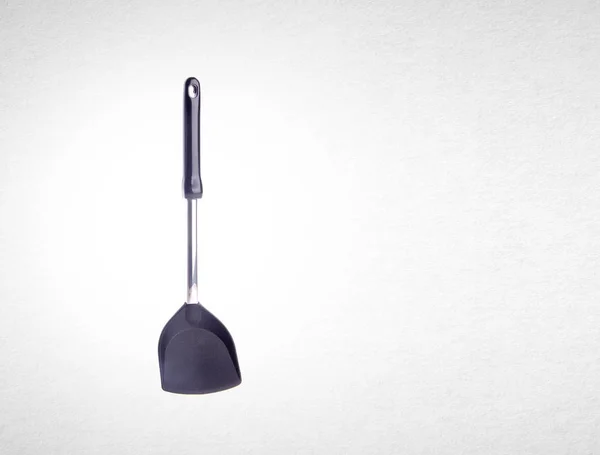 Kitchen utensils or spade of frying pan on background. — Stock Photo, Image