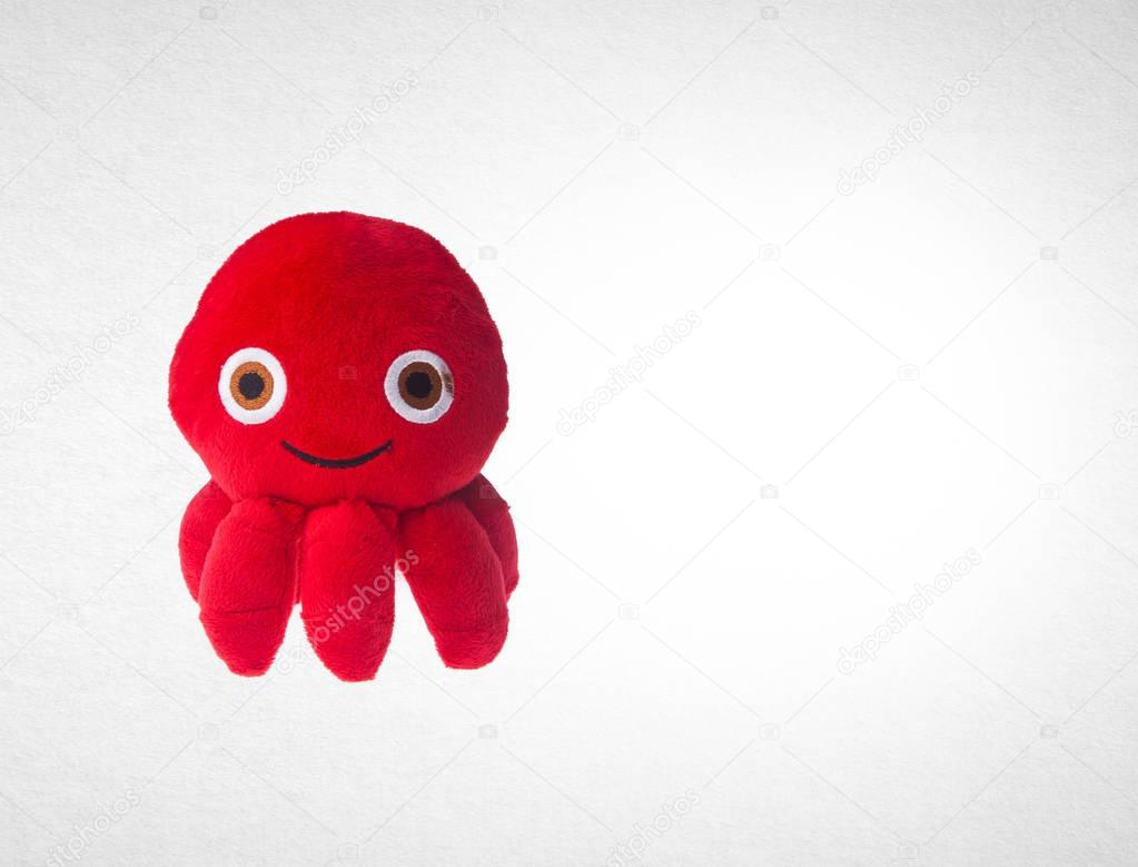 toy or octopus soft toy on the background.
